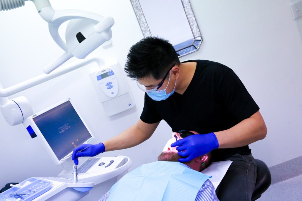 Dentist treating a patient at North Ryde Dentistry, Macquarie Park